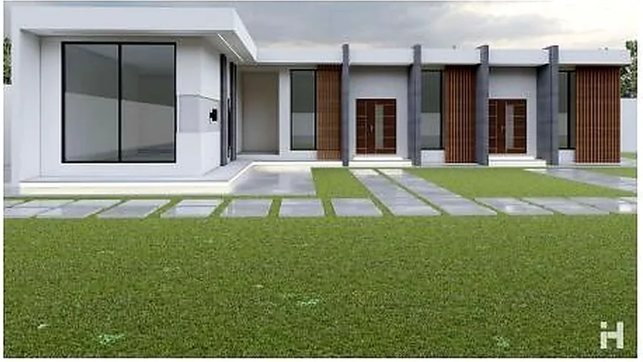 A row of chalet doors facing a lawn with stepping-stone paving.