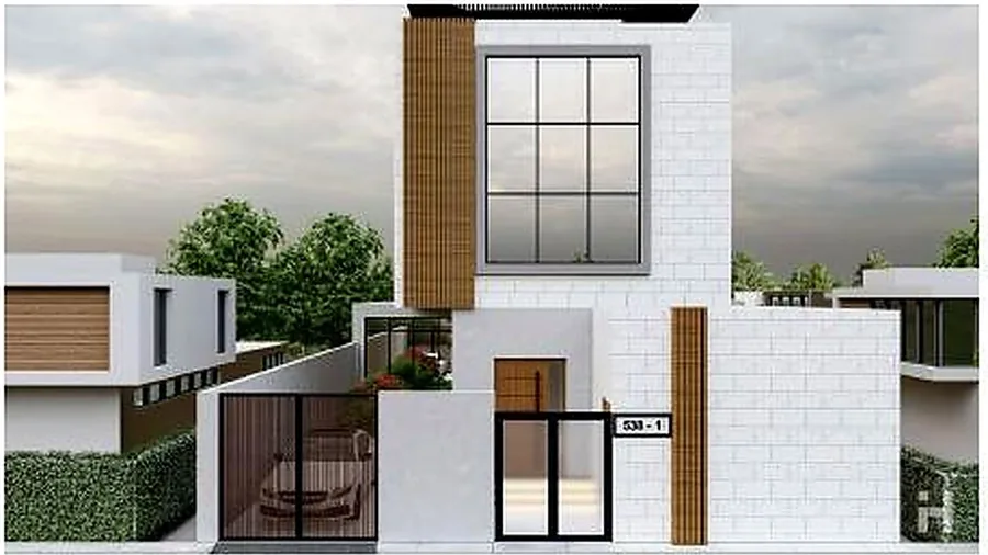 The villa's prominent entrance frame with timber slats and glazing above.